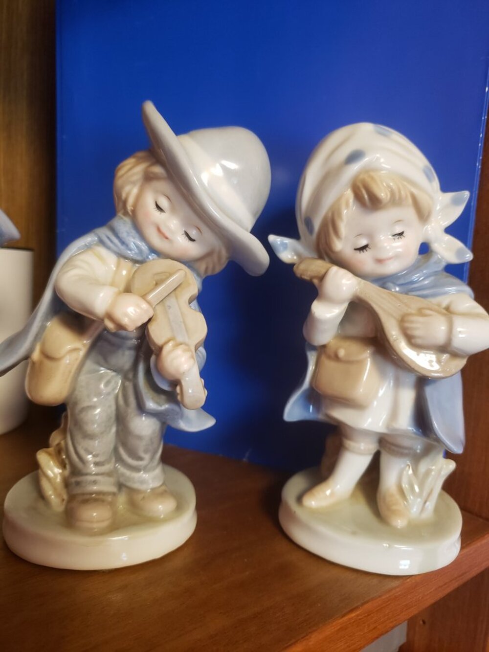 Vintage boy and girl playing Musical Instruments.